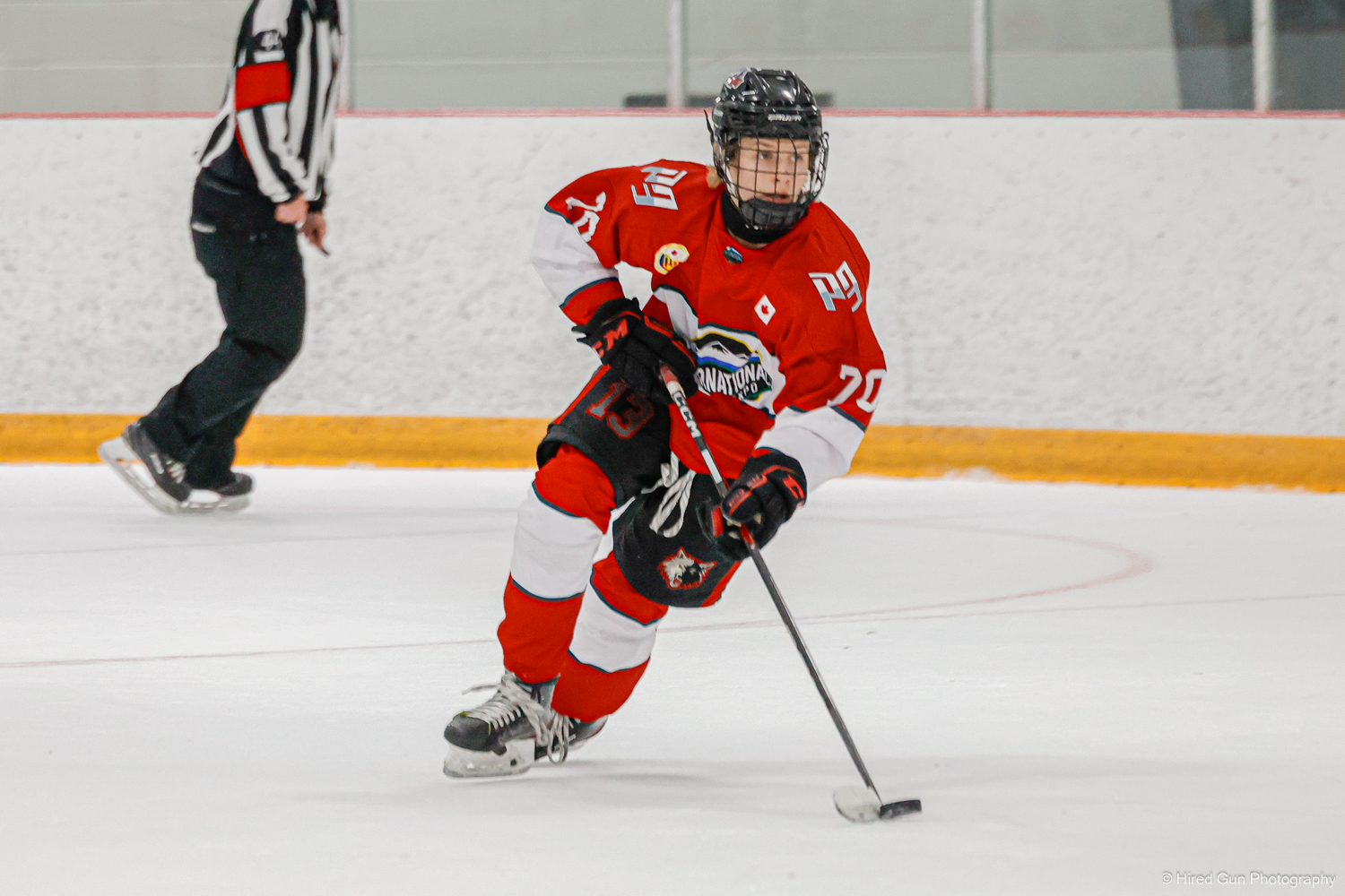 Bigfoot player carrying the puck up ice